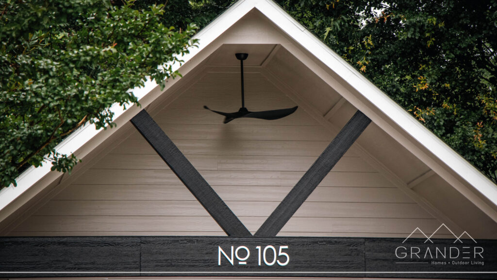 custom home exterior featuring covered porch, roofline detail, custom exterior craftsmanship in greenville, south carolina