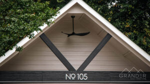 custom home exterior featuring covered porch, roofline detail, custom exterior craftsmanship in greenville, south carolina