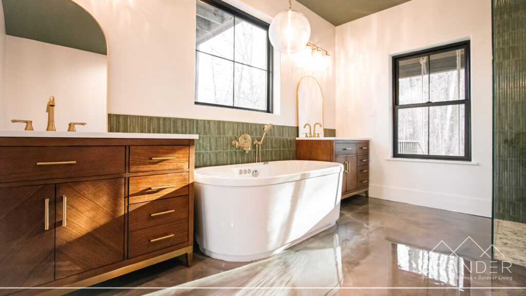 luxury bathroom featuring tile finishes, soaking tub, custom vanity in greenville, south carolina