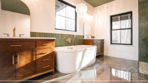 luxury bathroom featuring tile finishes, soaking tub, custom vanity in greenville, south carolina