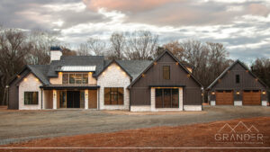 custom home exterior featuring covered porch, roofline detail, custom exterior craftsmanship in greer, south carolina