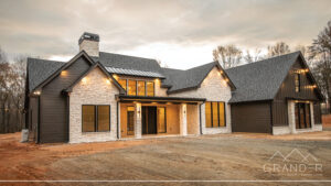 custom home exterior featuring covered porch, roofline detail, custom exterior craftsmanship in greer, south carolina